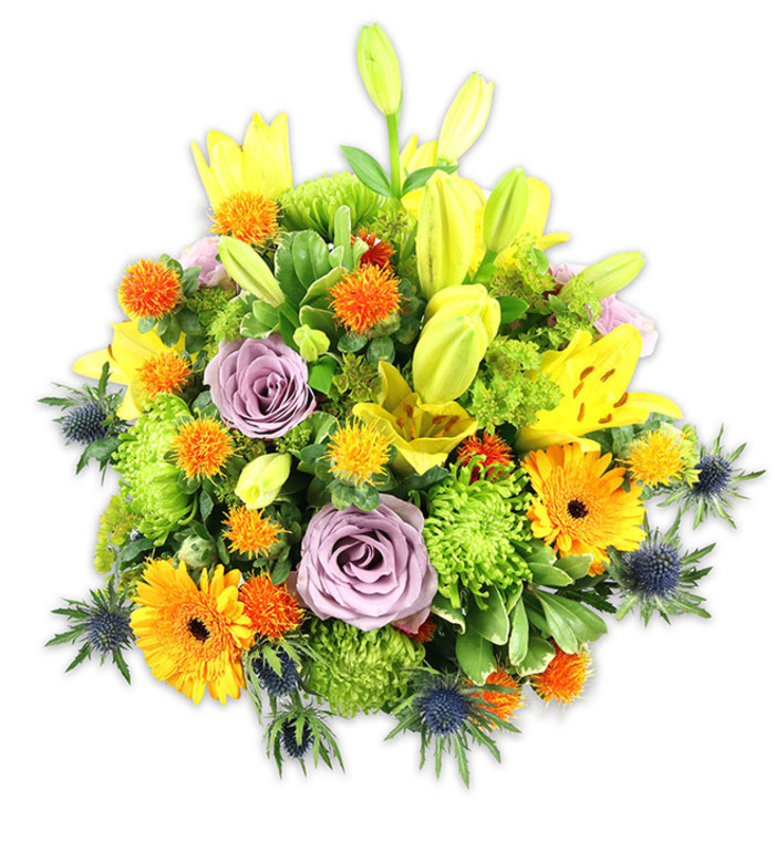 A richly textured, studio-lit bouquet sits against a stark white background, its composition a confident blend of colour, scent, and form that reads both joyful and sophisticated. Bright yellow Asiatic lilies reach upward - a mixture of fully opened, speckled blooms and elongated chartreuse buds that create vertical rhythm. Two pale lavender roses are placed thoughtfully toward the centre, their velvety spirals offering a gentle, cooling focal point amid warmer tones. Vibrant orange Gerbera daisies scatter through the arrangement with broad, flat petals and darker centres that catch the eye, while plentiful lime-green button chrysanthemums provide plush, sculptural volume and a fresh, verdant texture. Smaller spherical accents in orange and golden-yellow dot the bouquet, their spiky, craspedia-like shapes adding whimsical contrast. Distinctive blue-grey sea thistles (Eryngium) rise from the sides and lower areas, their spiny silhouettes giving the design a modern, slightly rustic edge. Varied foliage - glossy leaves, delicate sprigs, and structural greenery - knits the flowers into a cohesive, layered whole. This is the kind of arrangement I would prepare for a client requesting bright, uplifting blooms for a Notting Hill flat overlooking Portobello Road or for a thoughtful sympathy gesture sent to a family on Westbourne Grove. Prepared by Flower Delivery Nothing Hill with an eye for seasonal balance, it reads as both a celebratory centrepiece and a comforting, elegant gift.